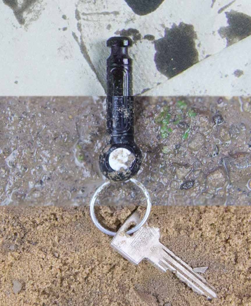 A keyTag on a wet surface with a key attached